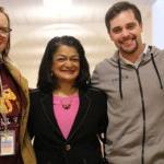 Pramila Jayapal and BF Day staff stand next to each other, smile at camera